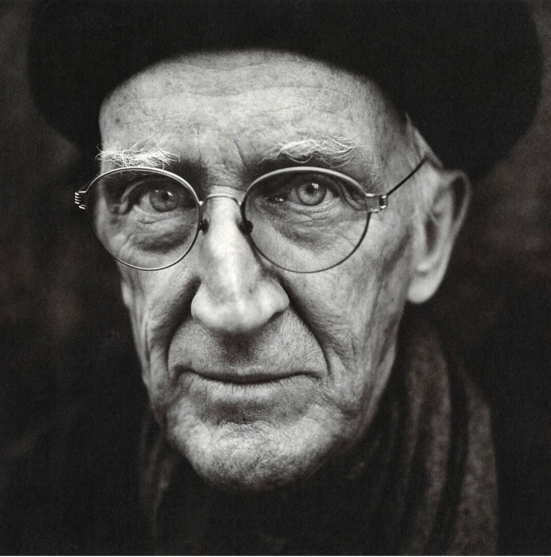 Black and white photograph of photographer Alen MacWeeney.